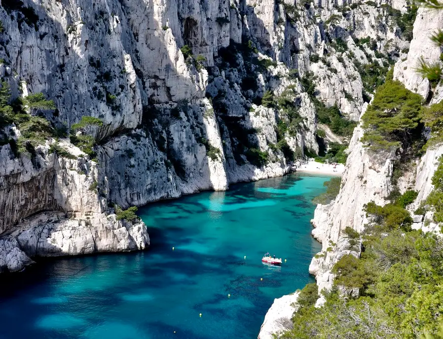 Swimmers at a cove during the Marseille Calanques boat tour