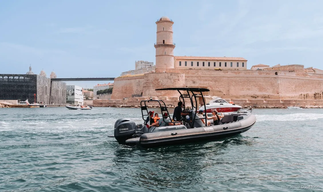 Small boat cruising the Old Port on the Marseille history boat tour